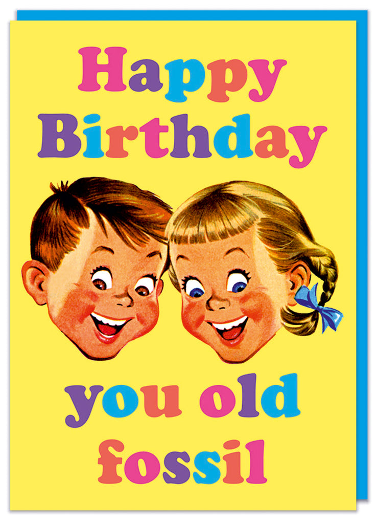 A yellow birthday card with a vintage illustration of two smiling children's faces.  Above and below multi coloured text reads Happy birthday you old fossil